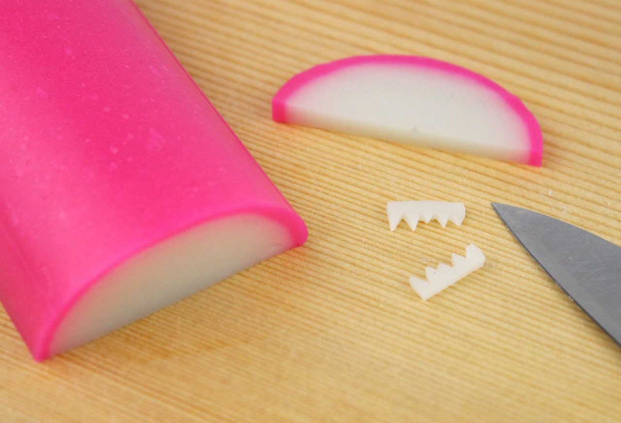 Cut jagged edges in kamaboko for teeth for Chewbacca noodle rolls.