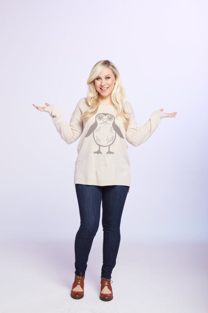 Ashley Eckstein, the voice of Ahsoka Tano, wears a Porg sweater from the Her Universe fashion line.