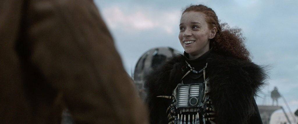 Enfys Nest, unmasked, smiles.