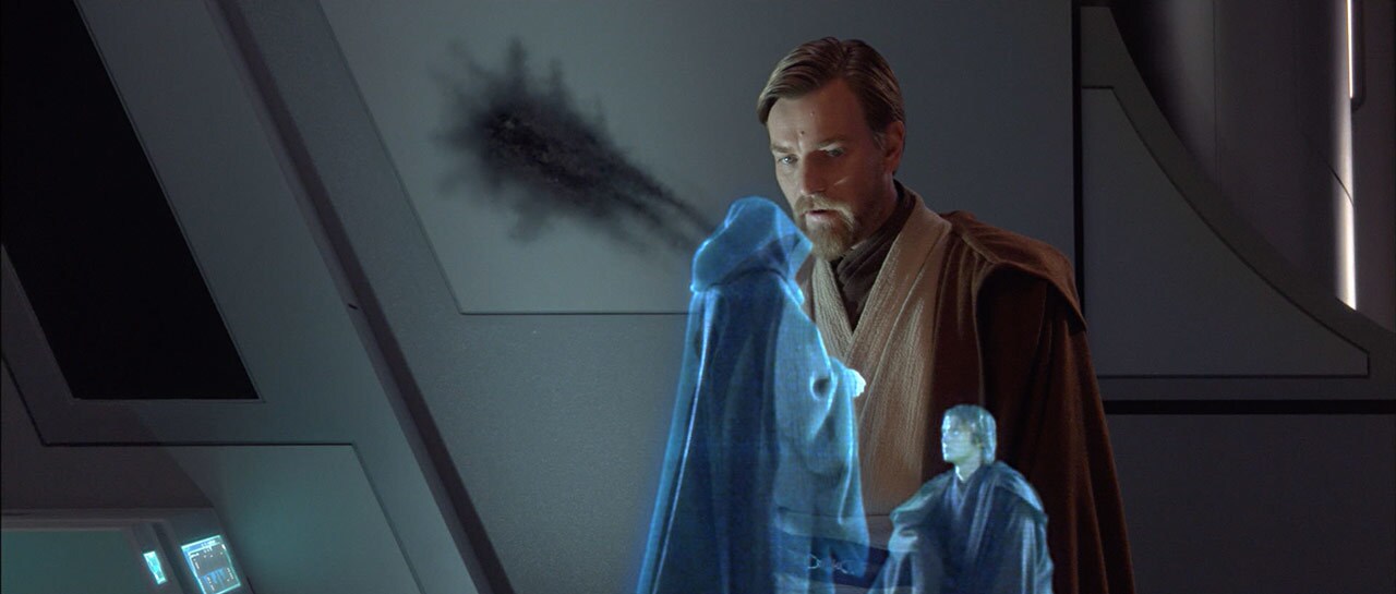 Obi-Wan watches a hologram of Anakin kneeling before Darth Sidious.