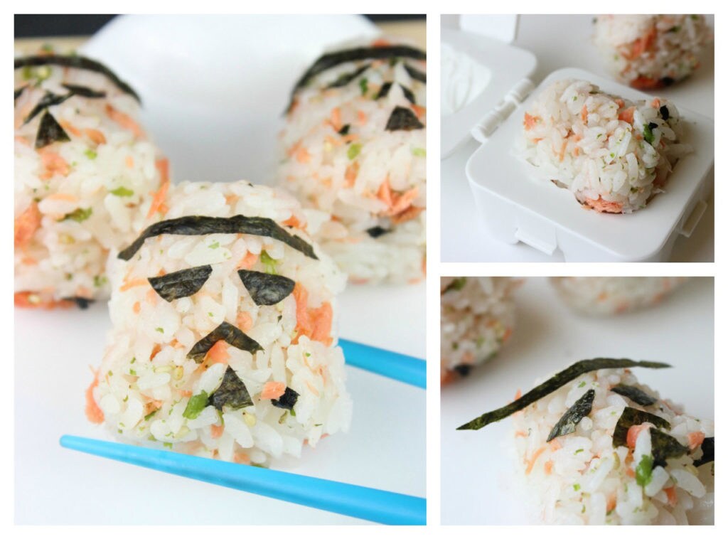 Stormtrooper rice balls with shaved salmon, shaped using a Kotobukiya Stormtrooper Egg Shaper. Seaweed is cut into small pieces to form the mouth, nose, and eyes.