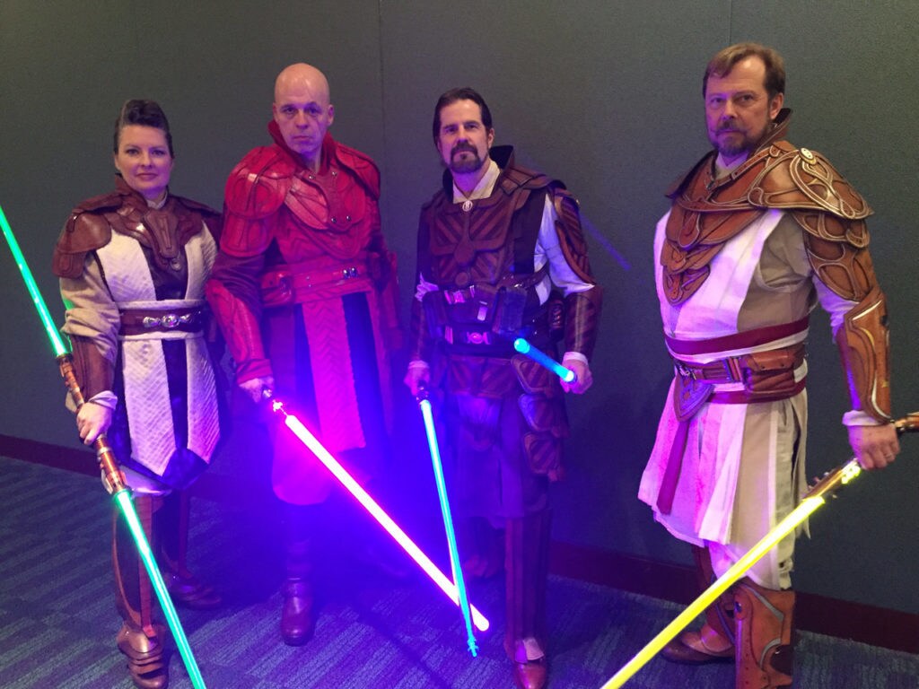 Cosplayers wield lightsabers at Celebration Orlando.