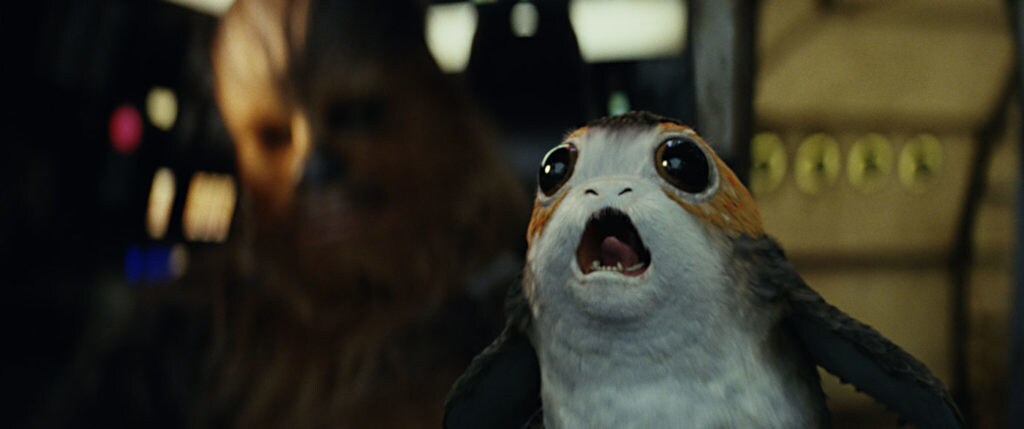 A Porg screams in the Millennium Falcon.