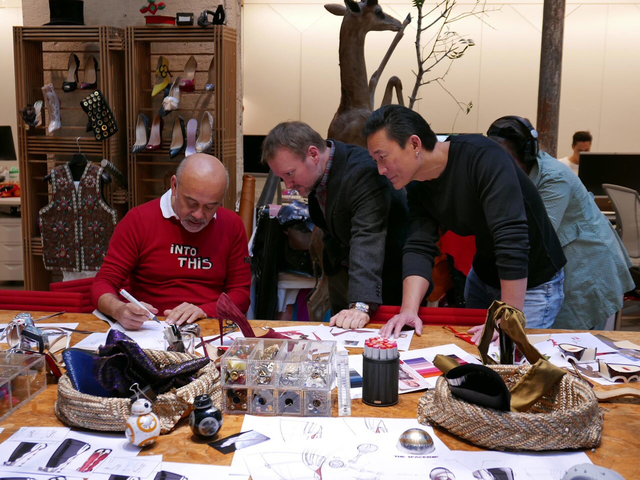 Christian Louboutin designs a Star Wars shoe as director Rian Johnson and ILM's Doug Chiang look on.