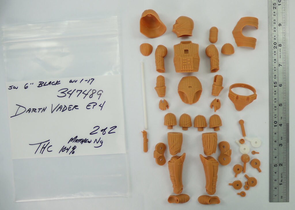 The unpainted pieces of a Darth Vader action figure, before assembly.