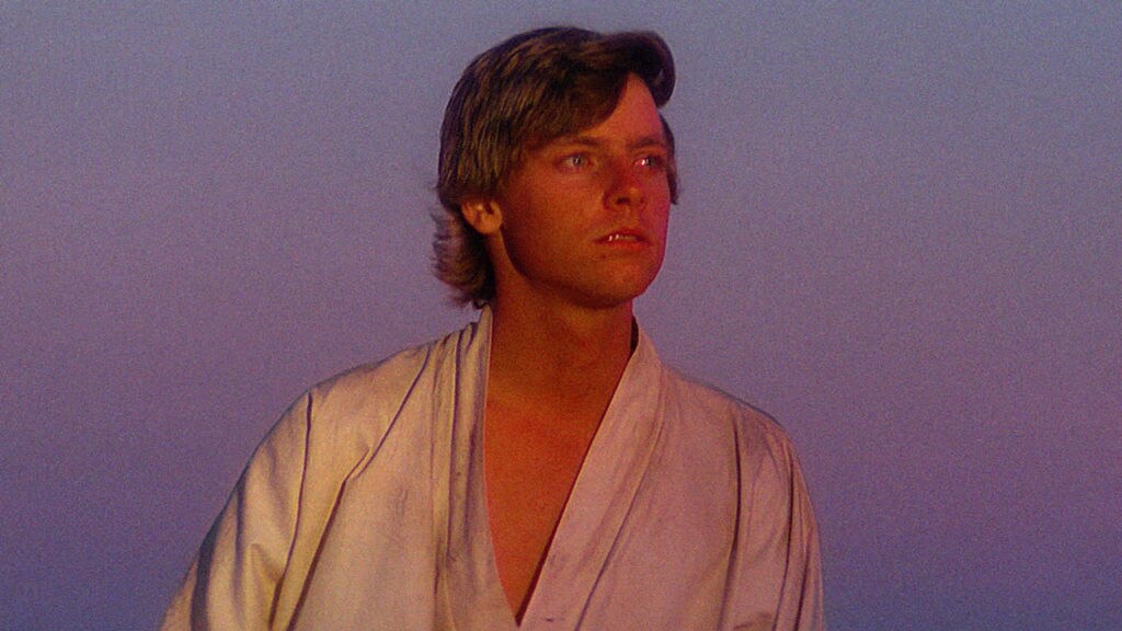 Luke Skywalker watches the suns set on Tatooine.