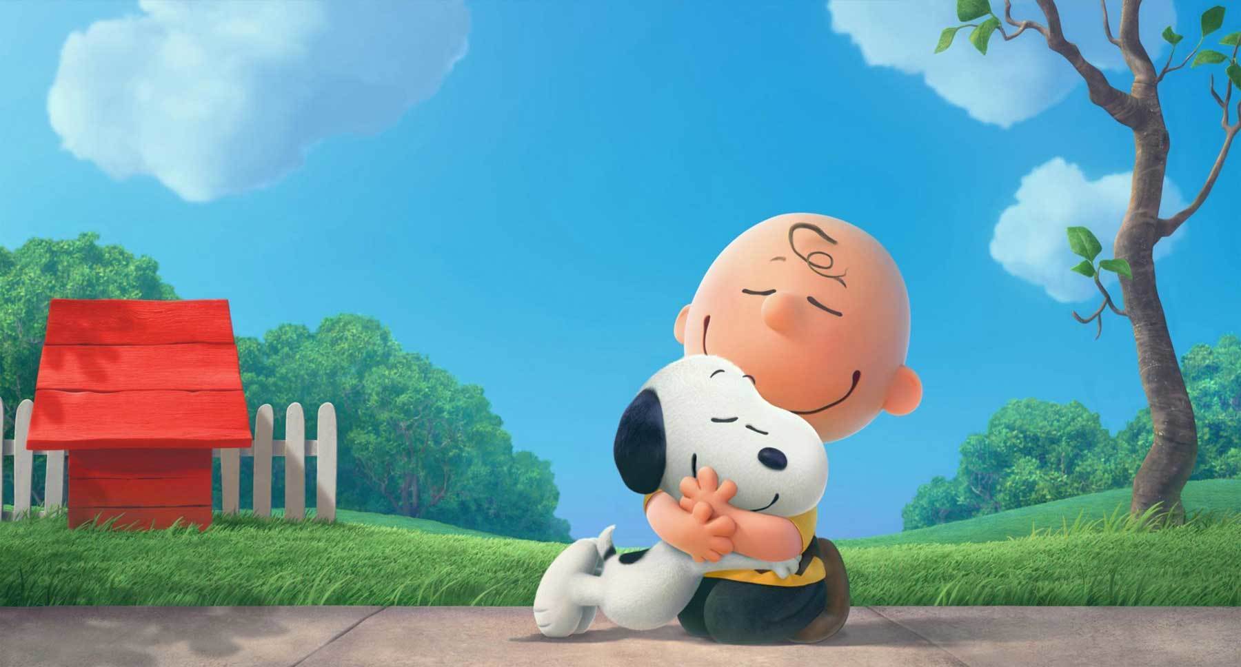 Snoopy (voiced by Bill Melendez) and Charlie Brown (voiced by Noah Schnapp) hugging in a scene from "The Peanuts Movie"