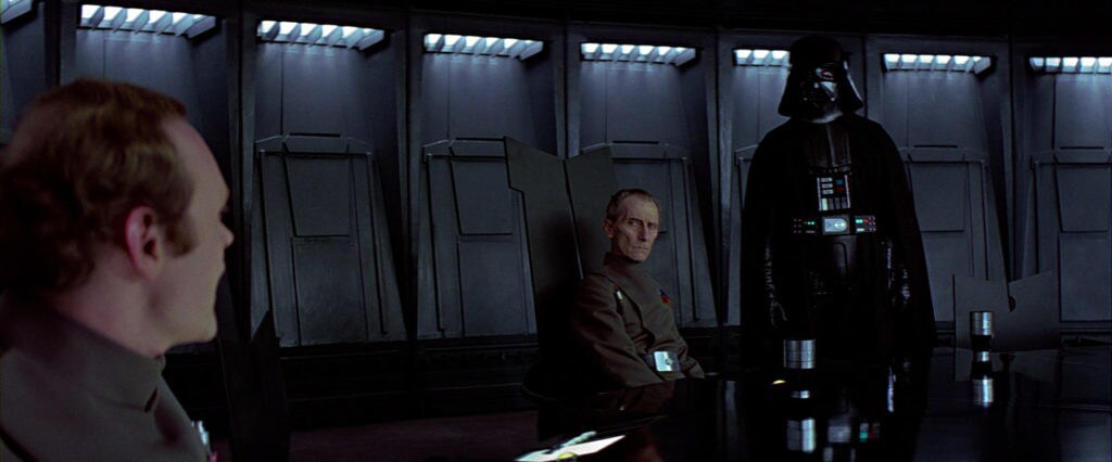General Motti, Grand Moff Tarkin, and Darth Vader in A New Hope.