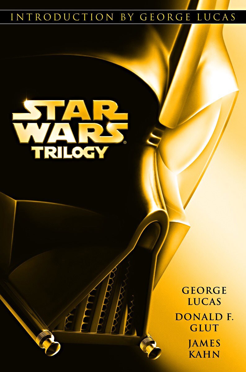 The cover of the 2004, all-in-one, hardcover edition of the Star Wars Trilogy book collection. Darth Vader appears with a golden light illuminating half of his face.