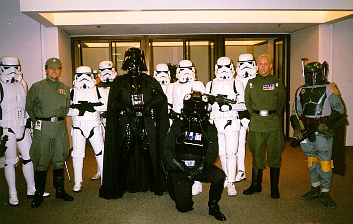 Star Wars fans dressed as Darth Vader, Rhymer, Stormtroopers, Imperial officers, and Boba Fett.