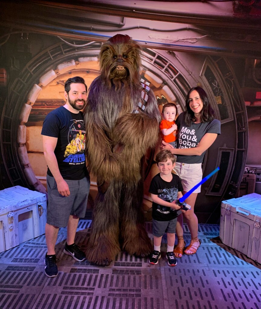 A family meets Chewbacca on Star Wars Day at Sea.