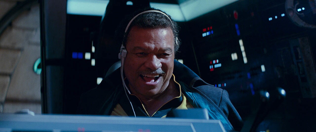 Lando Calrissian laughts while piloting the Millennium Falcon in The Rise of Skywalker.