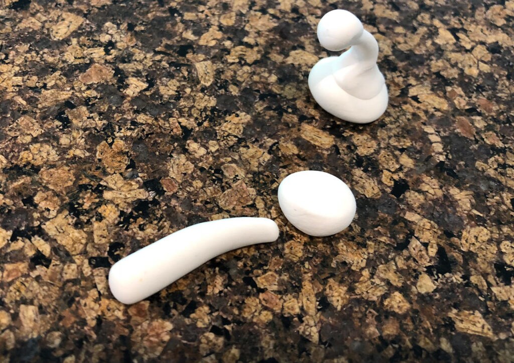 White modeling clay shaped into antenna shapes.