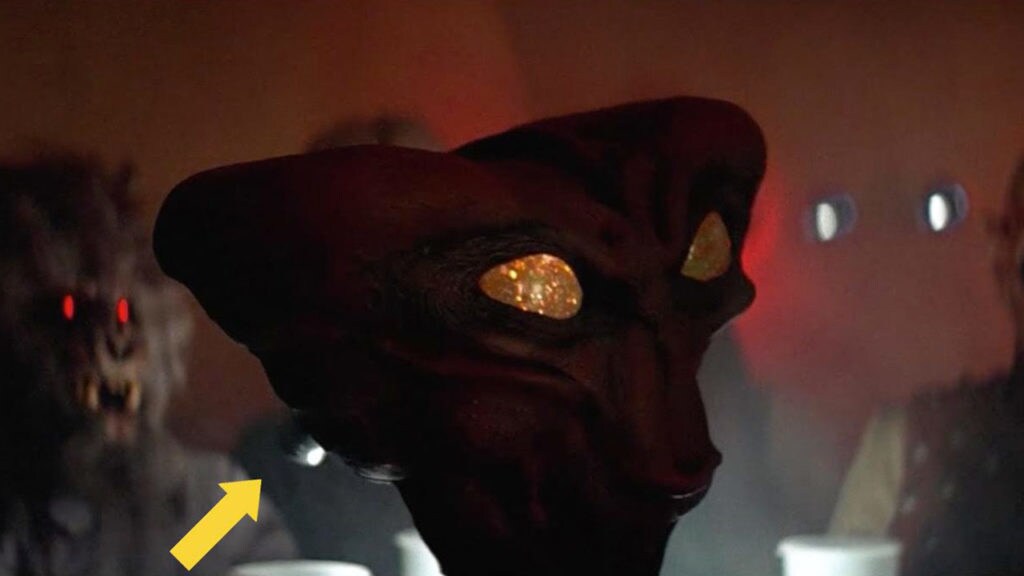 A screenshot indicating a flashlight used to light up the eyes of an alien head on the set of A New Hope's cantina sequence.