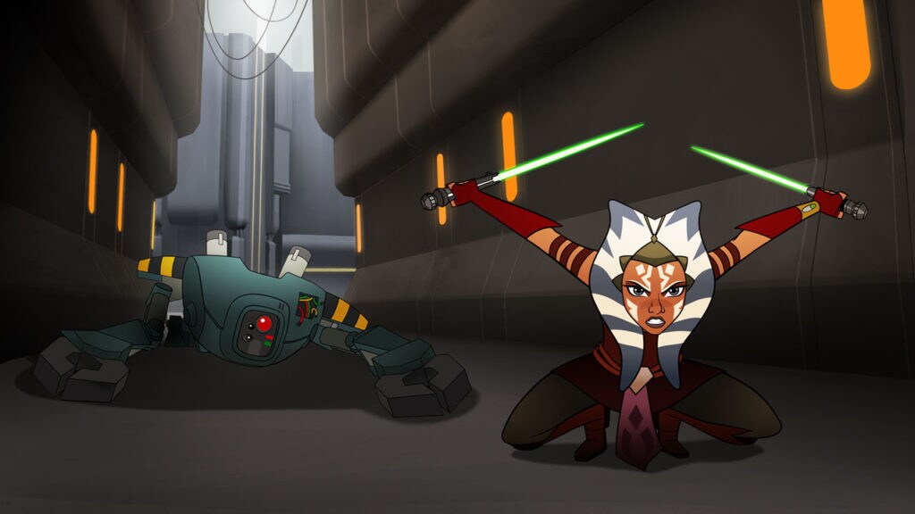 Ahsoka Tano crouches in a fighting pose with two green lightsabers extended. The droid she defeated lies on the ground behind her.