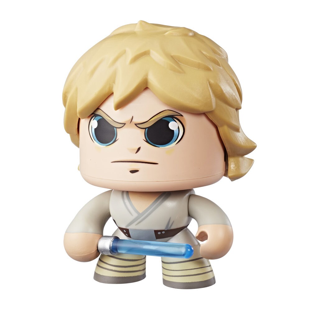 A Luke Skywalker Star Wars Mighty Muggs collectible figure holds a lightsaber with a stern expression on its face.