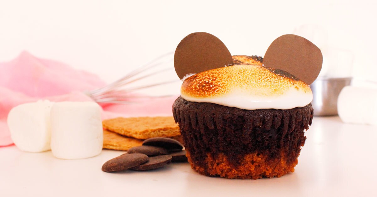 A s'more cupcake with Mickey Mouse ears made of large chocolate wafers.