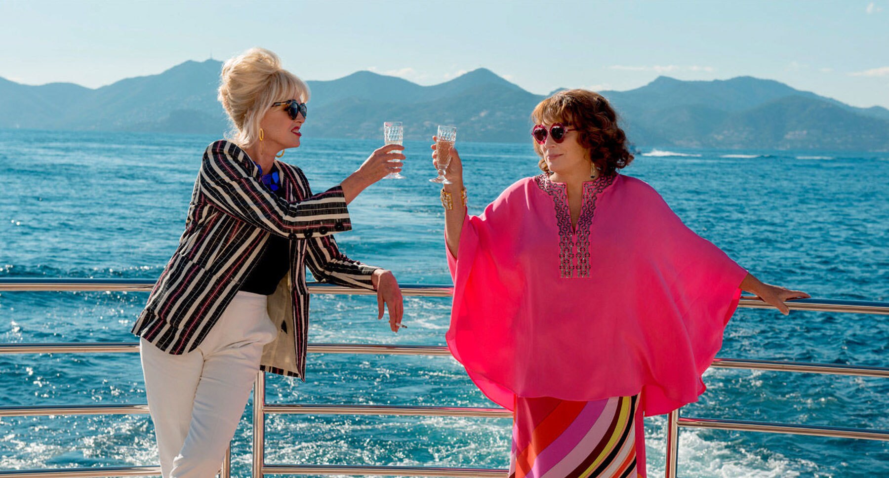 Actors Jennifer Saunders (Edina) and Joanna Lumley (Patsy) toasting in "Absolutely Fabulous: The Movie"