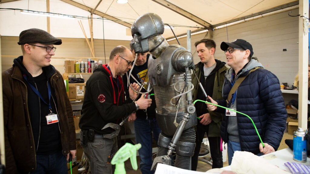 Brian Herring and members of the creature shop work on a medical droid for Solo: A Star Wars Story.