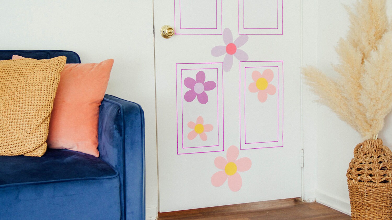 A real door made to look like Boo's door from Monsters, Inc., made with white and colorful construction paper.