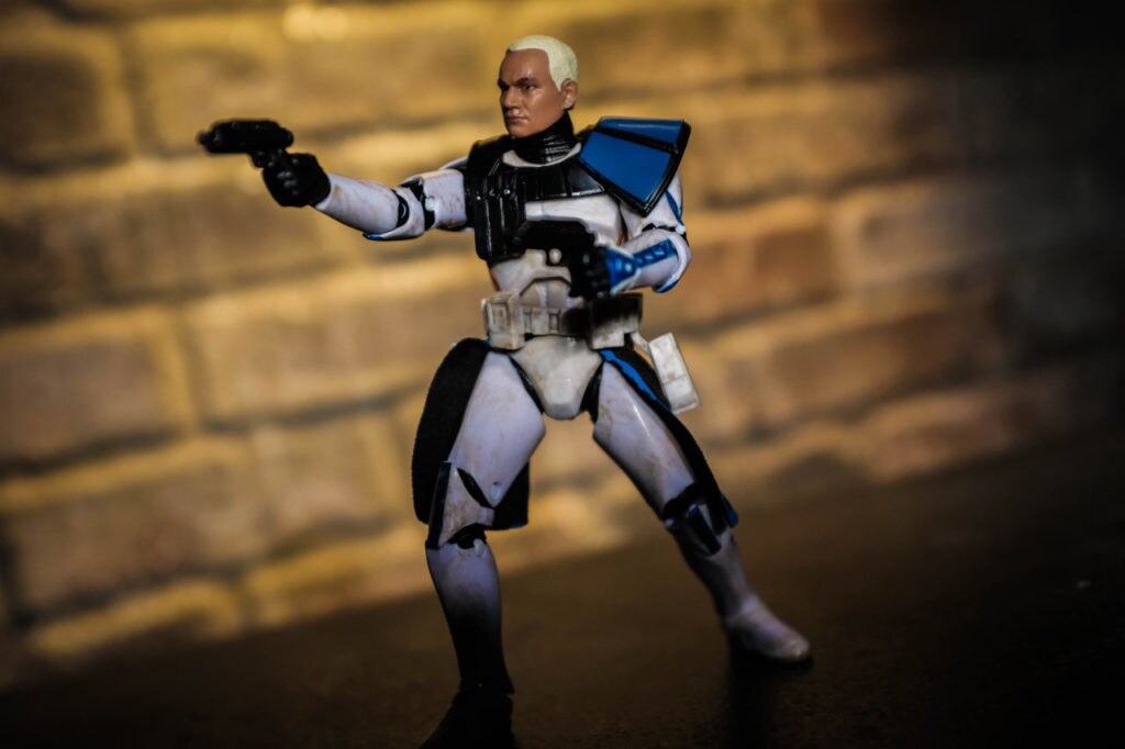 Captain Rex action figure holding up his blasters from the Star Wars: The Black Series collection.
