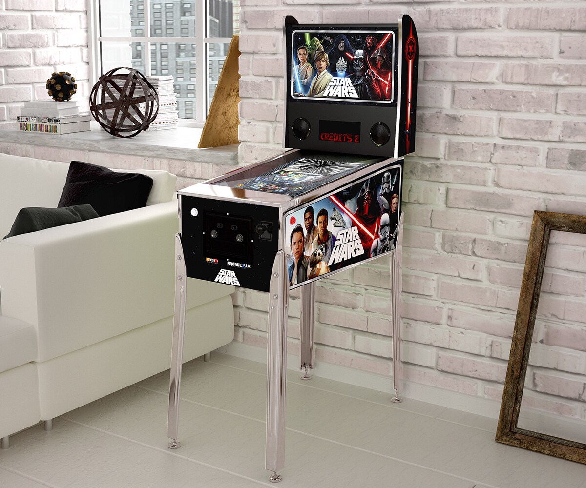 A Star Wars themed pin-ball game inside a living room.