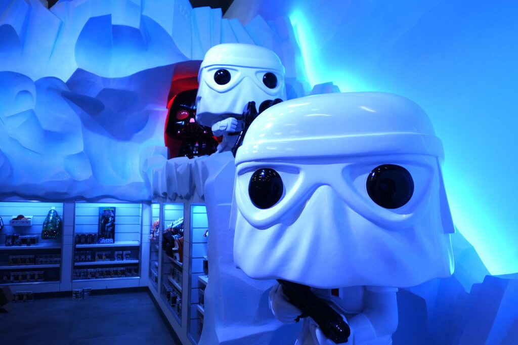 Funko stormtroopers with Darth Vader in the background flank the icy walls of Echo Base in Funko's HQ store and fan space.