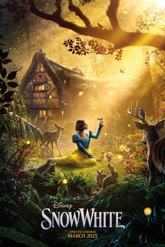 The movie poster for Disney's Snow White (2025) featuring Snow White sitting in the grass in front of a cottage with a bird on her finger and the forest creatures gathering around her.