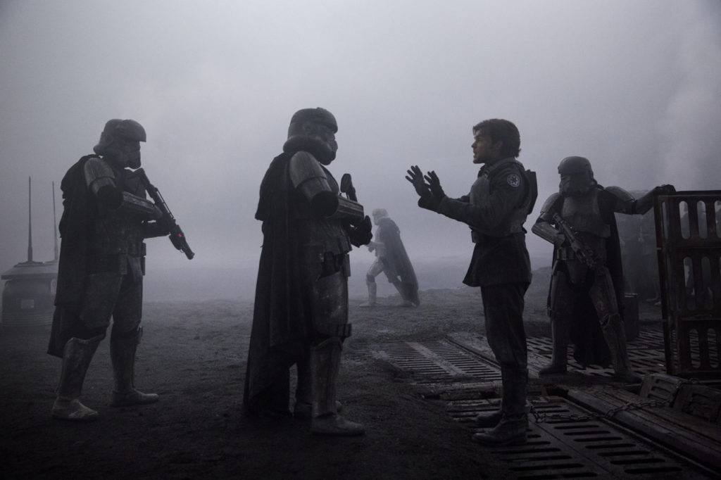 Han Solo tries to talk his way out of trouble to two stormtroopers on Mimban in Solo: A Star Wars Story.