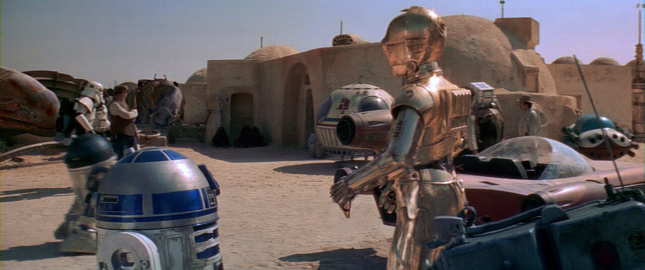 C-3PO and R2-D2 wait outside the Mos Eisley cantina.