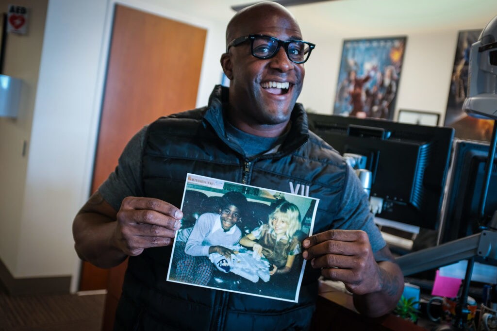 Billy Ray Chubbs of ILM holds a photo of himself and a childhood neighbor, his first Star Wars friend.