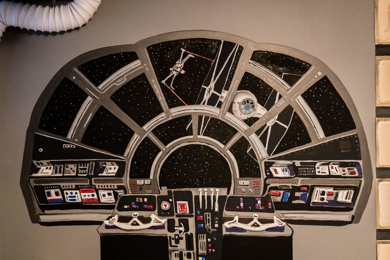 A wall decal that looks like the Millennium Falcon's cockpit.