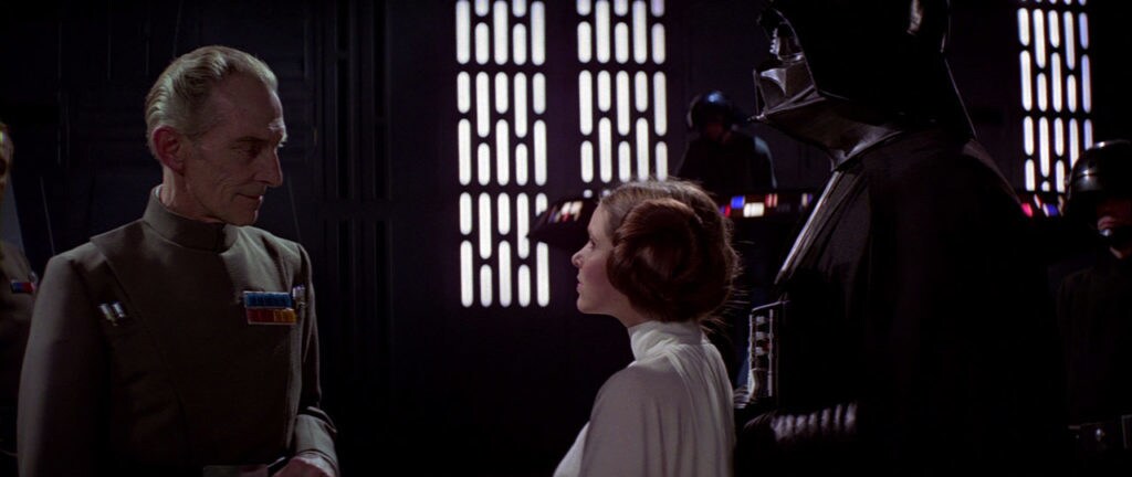 Grand Moff Tarkin, Princess Leia, and Darth Vader in A New Hope.