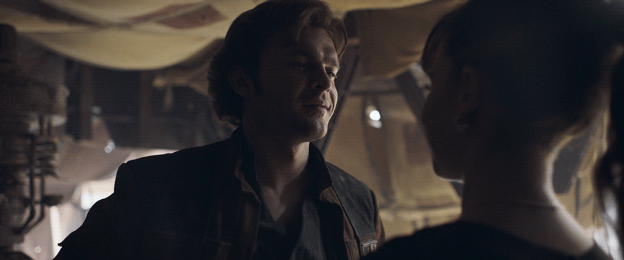 Han Solo smiles at Qi'ra in a GIF.