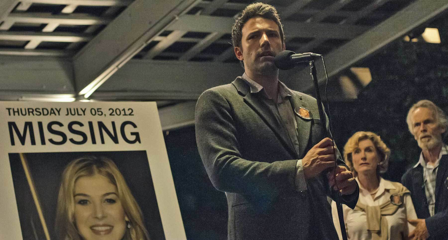 Ben Affleck (Nick) speaking into a microphone in "Gone Girl"