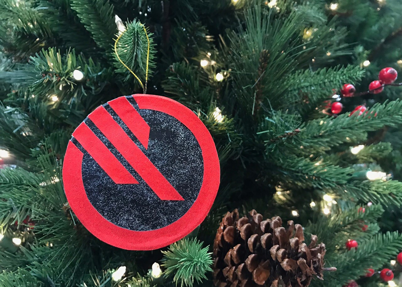 An Inferno Squad ornament hangs from a Christmas Tree.