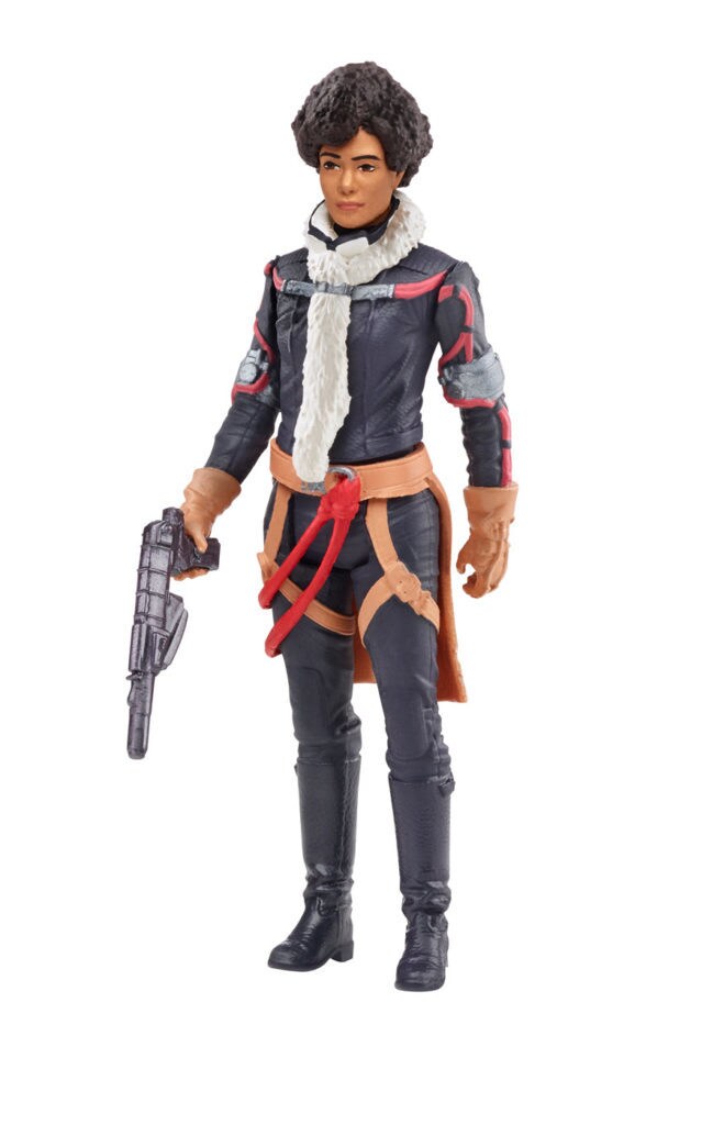 A Val Hasbro action figure holds a blaster from Solo: A Star Wars Story.