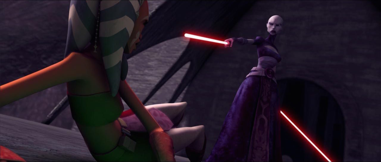 Asajj Ventress points one of her two lightsabers at Ahsoka Tano who cowers on the ground in Star Wars: The Clone Wars.