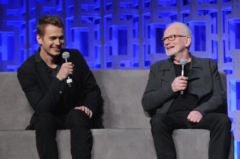 Ian McDiarmid and Hayden Christensen sit on stage at Star Wars Celebration Orlando's 40 Years of Star Wars panel.