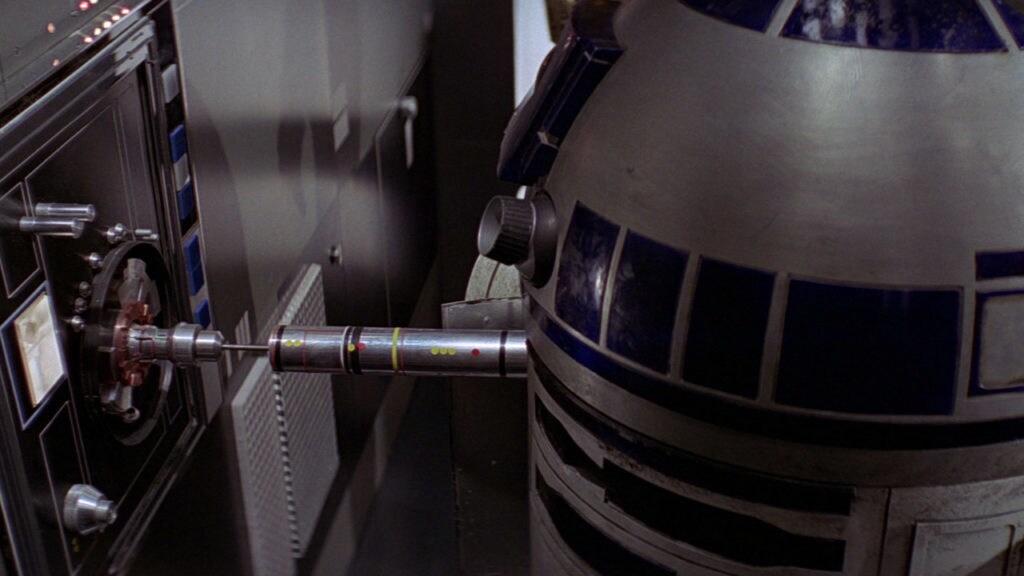 R2-D2 plugs into a control terminal onboard the Death Star.