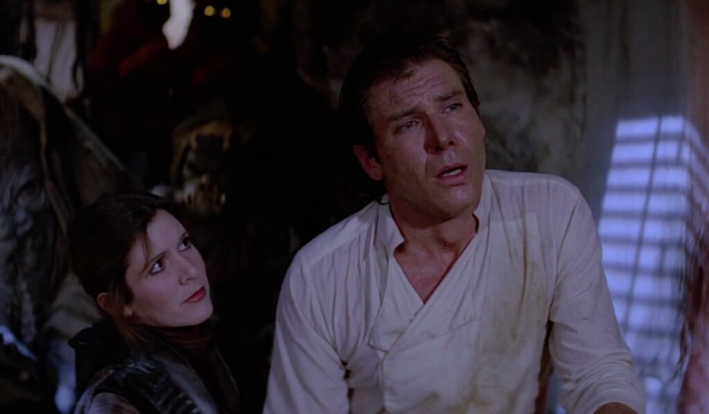 After being freed from carbonite, Han Solo slouches while Princess Leia stands next to him in Return of the Jedi.