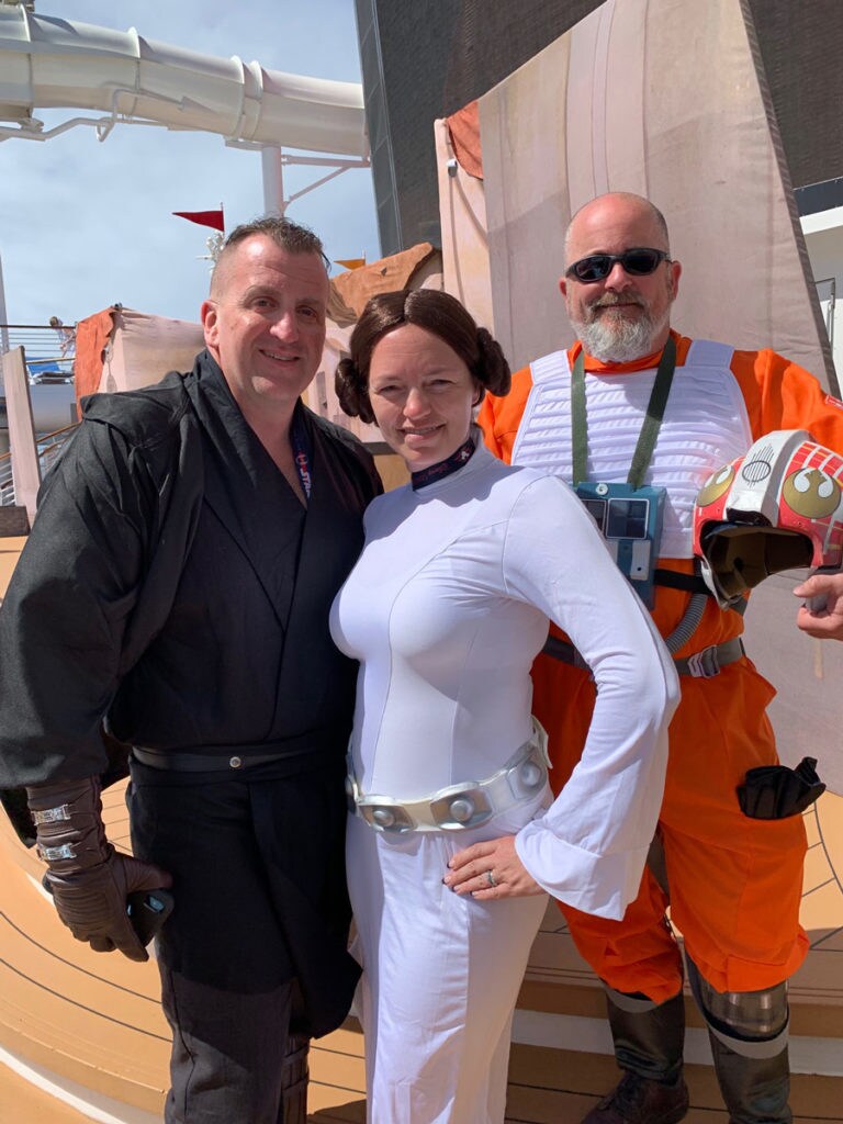 Star Wars fans cosplaying as Anakin Skywalker, Leia Organa, and Porkins