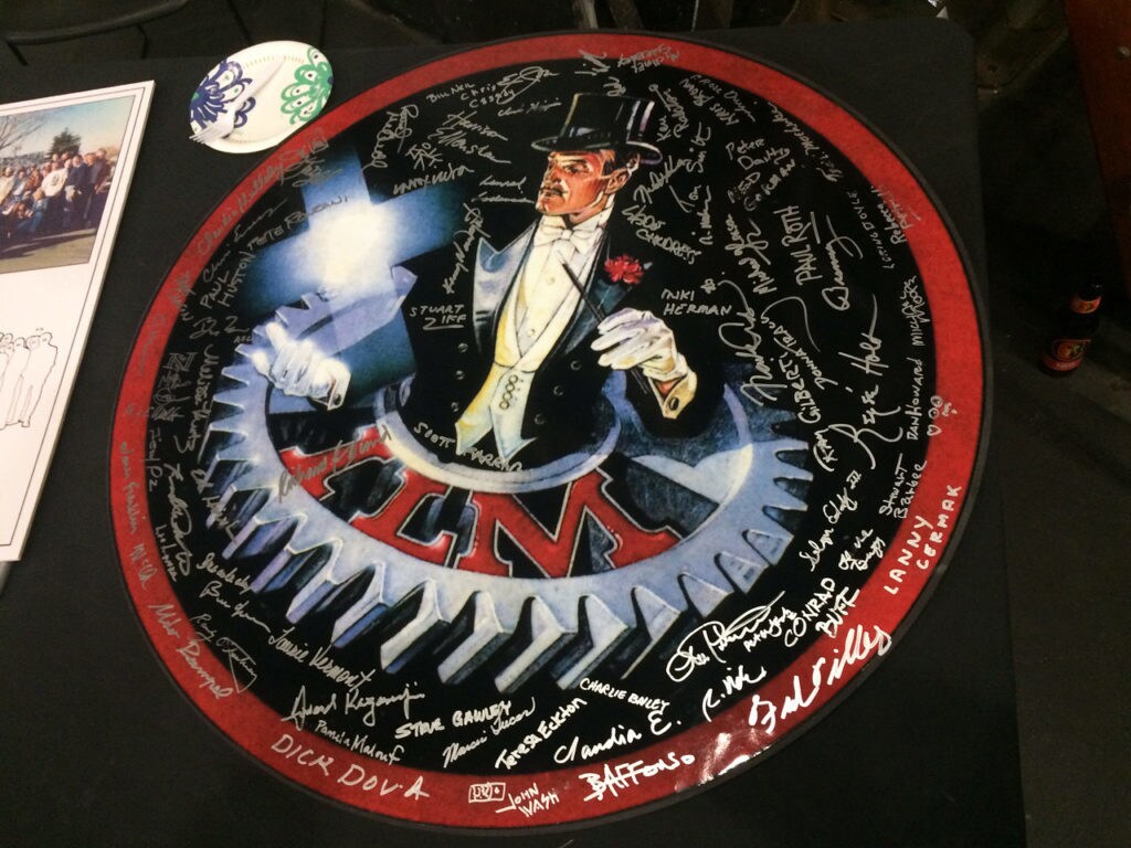 A commemorative board, featuring the classic ILM insignia, signed by the original Star Wars artists and crew at their 40th Anniversary Reunion.