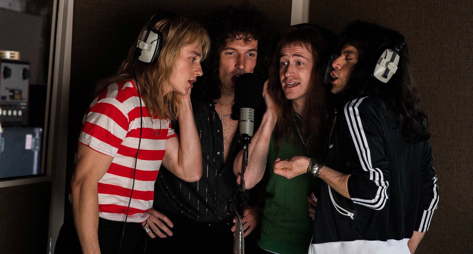 Rami Malek (as Freddie Mercury) Gwilym Lee (as Brian May), Ben Hardy (as Roger Taylor), and Joseph Mazzello (as John Deacon) singing in the movie "Bohemian Rhapsody"