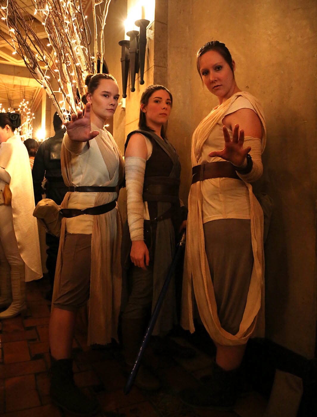 Three cosplayers dressed as Rey for the premiere of The Rise of Skywalker.
