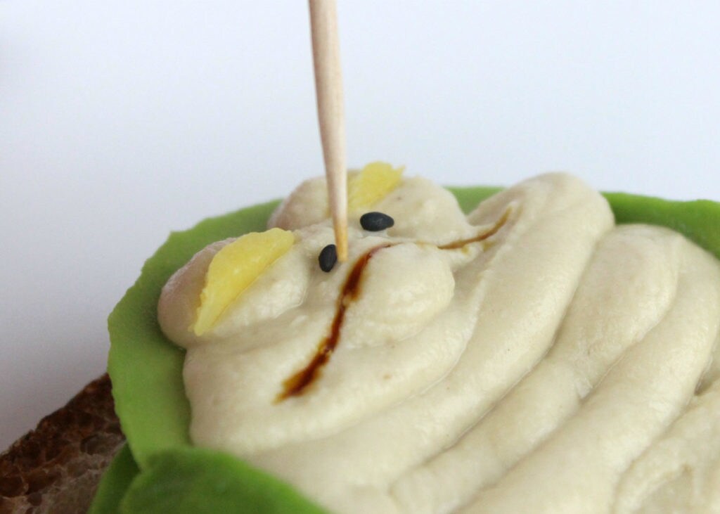A toothpick is used to adjust the facial features on Jabbacado toast.