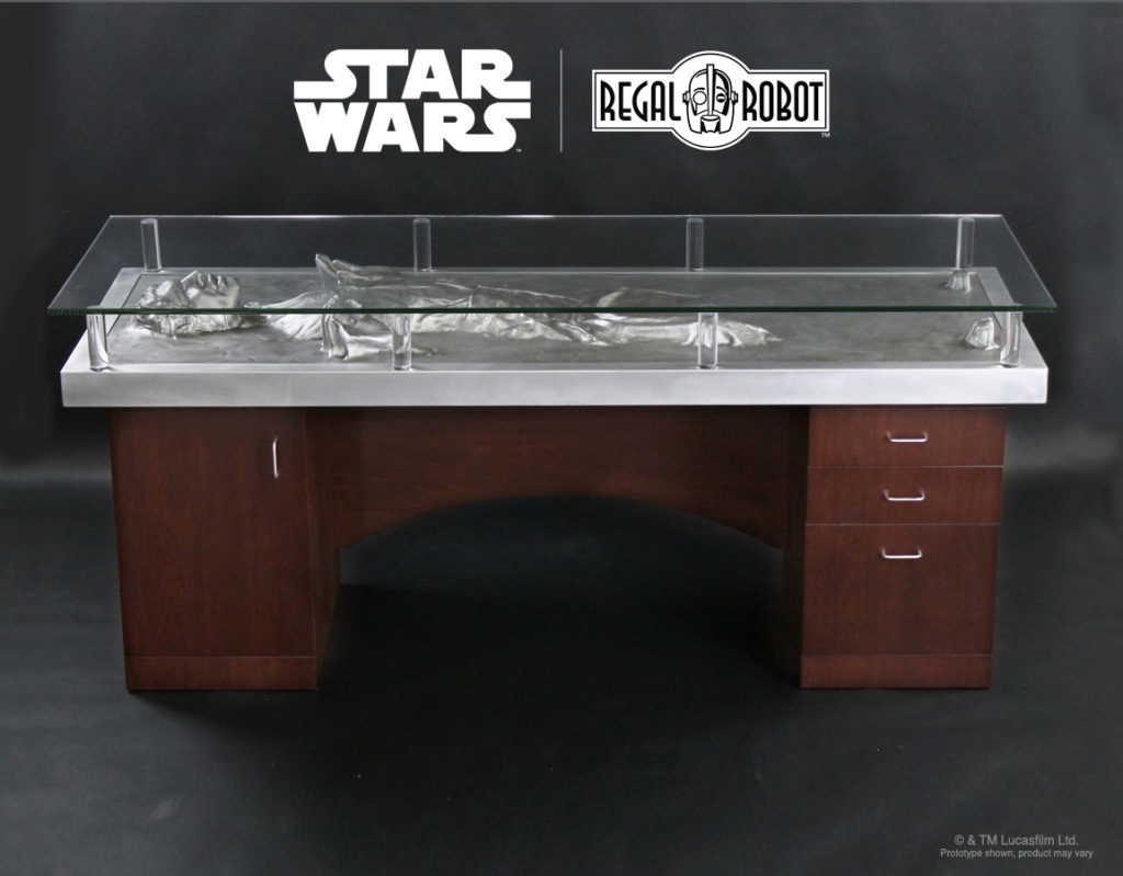 A desk modeled after Han Solo in carbonite, with a glass top to protect the replica piece.