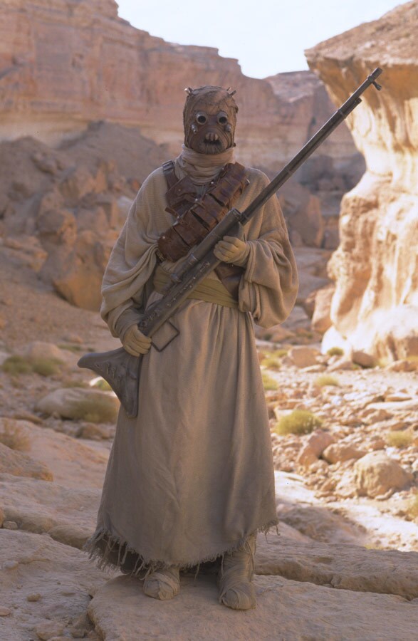 A Tusken Raider poses with his weapon.