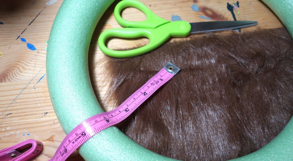 Chewbacca wreath craft - scissors and tubing.