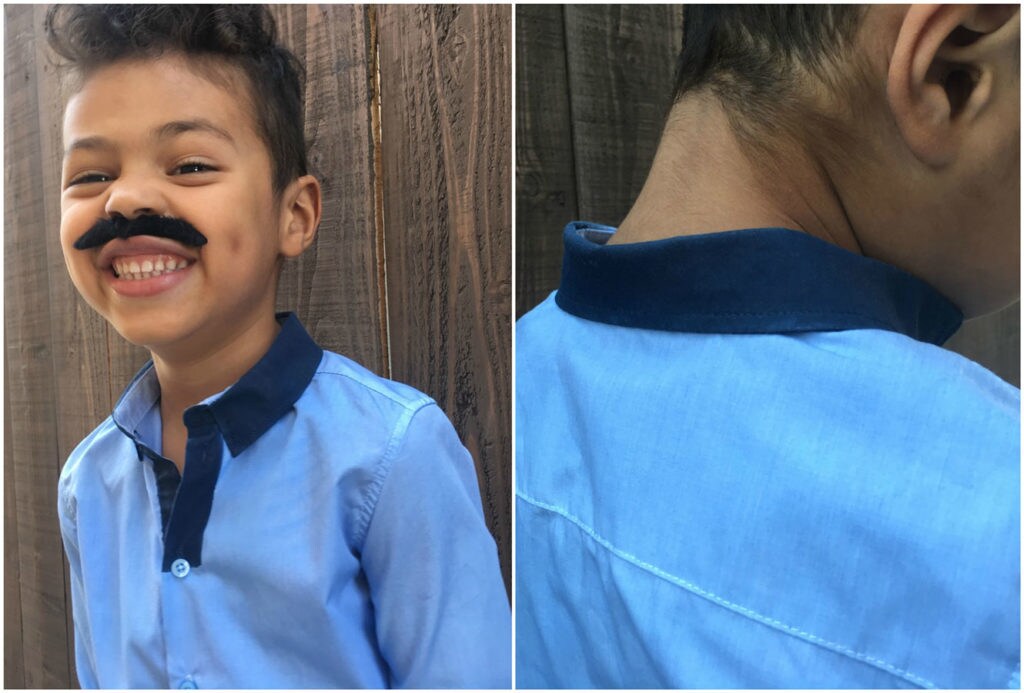 A child models a DIY Lando Calrissian Halloween costume, including a fake mustache.